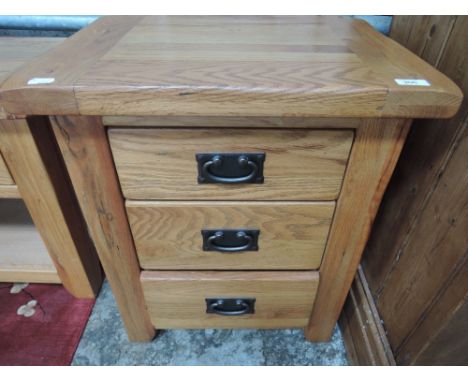 A set of modern light oak bedside drawers