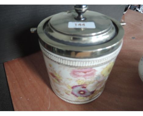 A ceramic biscuit barrel by SF & Co with plated rim and lid