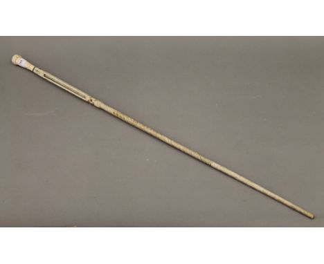 A 19th century ivory and marine ivory carved walking stick. 94 cm long.