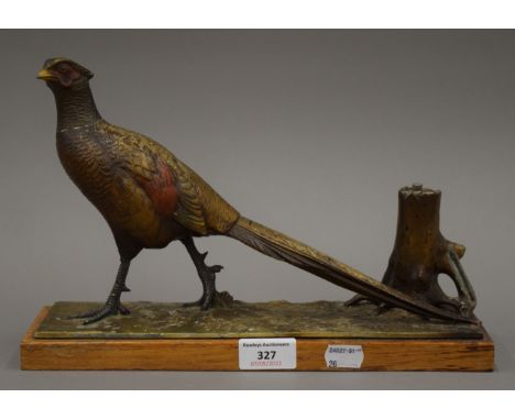 An early 20th century pheasant form table lighter. 31 cm long.