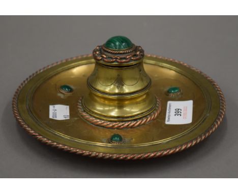 A Victorian brass and malachite inkwell. 17.5 cm diameter.