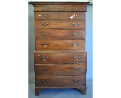 A George III mahogany chest on chest with Greek key pattern cornice, standing on bracket feet.  111 cm wide x 190 cm high.