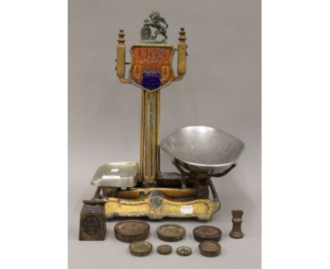 A small sized Lion scale and weights by Herbert &amp; Sons. 44 cm high.