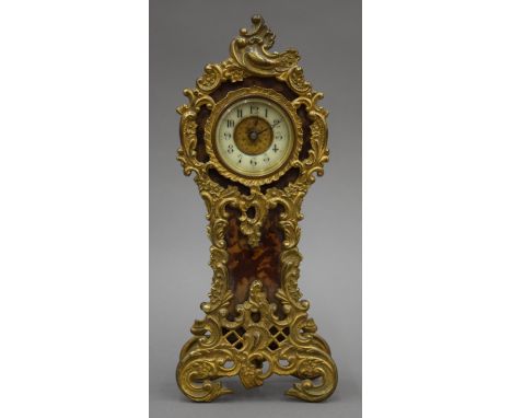 A 19th century brass mounted mantle clock. 25 cm high.