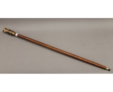 A walking stick, the handle formed as a telescope and a compass. 99 cm high.