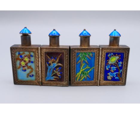 A set of four Chinese silver and enamel folding hinged snuff bottles.  4 cm high, 8 cm long opened.
