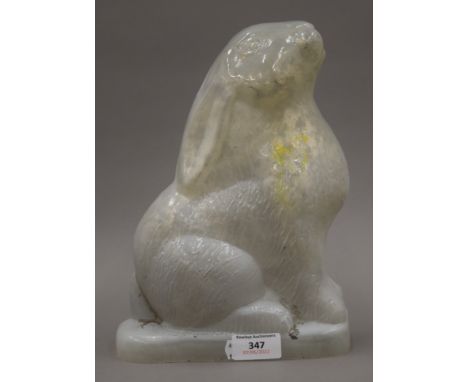 A vintage glass lamp shade in the form of a seated rabbit. 26 cm high.