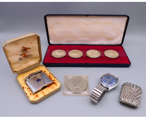 A vesta, a Ronson lighter, an Avia wristwatch, four Austrian coins and a 1977 Jubilee coin.  Vesta 4.75 cm x 3.5 cm. 