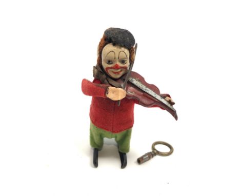 Vintage Schuco wind up clown playing violin the clown does wind uo and work key is not original 