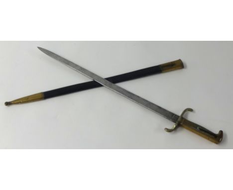 A replica German walking out bayonet with brass mounts and leather scabbard length 60cm