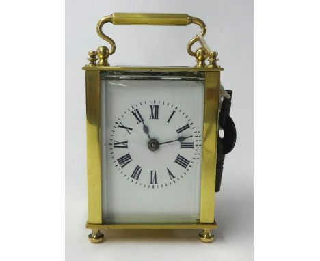 Brass case carriage clock with platform escapement and key, 11cm.