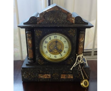 A Victorian slate and marble mantle clock, with 8 day movement, having gilt central dial decoration.