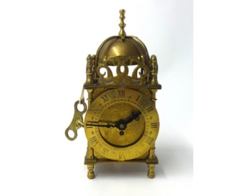 A reproduction small Smiths lantern clock height, 18cm.