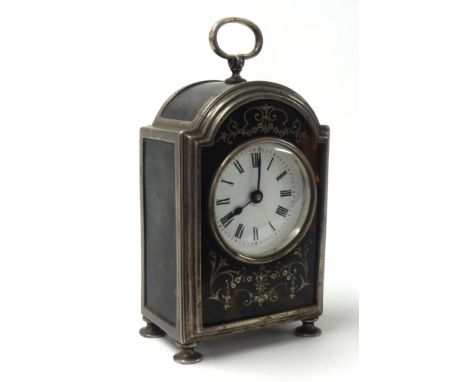 A Geo V silver tortoiseshell cased mantle clock, the white enamel dial set with roman numerals, the case inlaid with foliate 