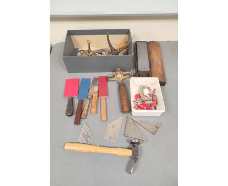Bookbinding tools to include typeset holder, gilding spatula, doming hammer, Arkansas stone, among others.&nbsp;