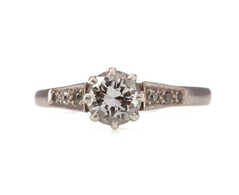 DIAMOND SOLITARE RING,the round brilliant cut diamond of approximately 0.58 carats, on diamond shoulders, marked 18CT &amp; P