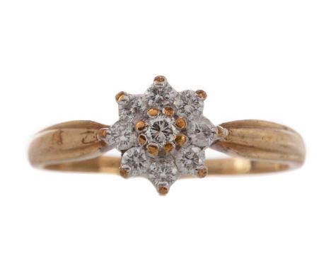 DIAMOND FLOWER RING,the round brilliant cut diamonds totalling approximately 0.25 carats, in nine carat gold, size K 1/2, 1.7