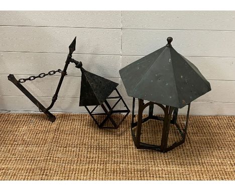 A cooper hanging lantern and a iron wall hanging lantern 