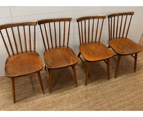 Four Danish stick back chairs 