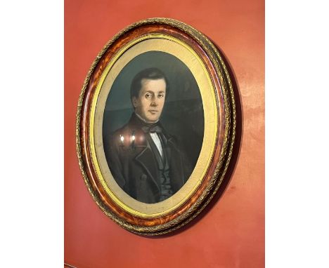 A portrait of a gentleman in an oval frame