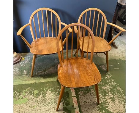 Three Ercol stick back dining chairs