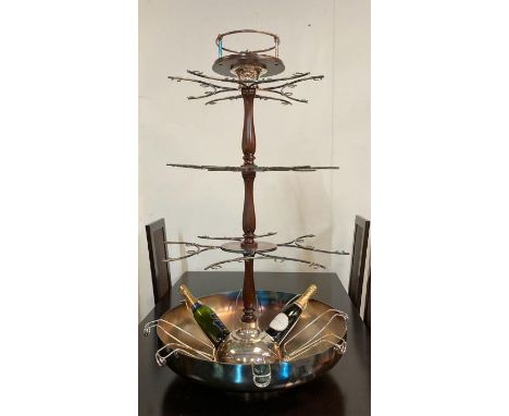 A Christofle champagne fountain. the central basin comprising of eight champagne cradles leading to a three tiered turned mah
