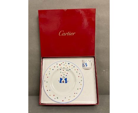 A boxed Cartier "La Maison Des Enfants" plate and egg cup with blue panthers 