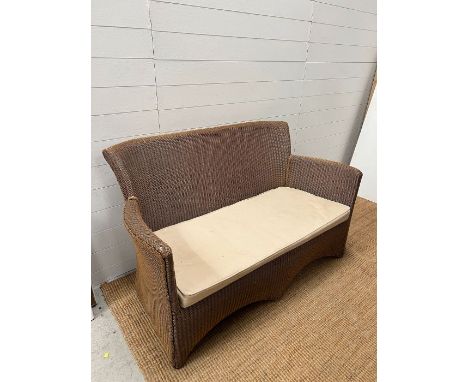 A rattan two seater sofa (H84cm W141cm D68cm SH40cm)