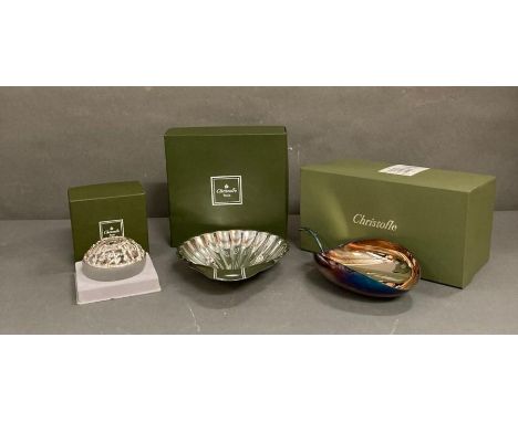 A selection of three boxed Christofle silver plated items to include a tea light holder, scallop bowl and a leaf bowl 