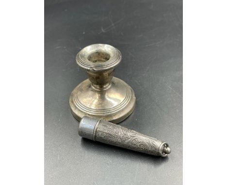A silver squat candlestick with indistinct hallmarks along with a cheroot holder case (Hallmarked for Francis Webb Birmingham