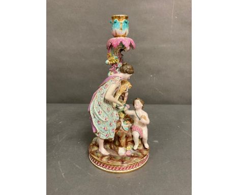 An 19th Century German porcelain single candlestick with figural design with child H39cm 