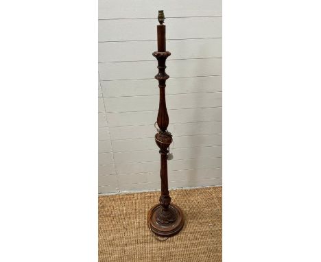 A wooden standard lamp 