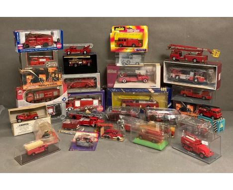 A large selection of various Diecast and plastic fire engines to include Matchbox, Corgi and Siku