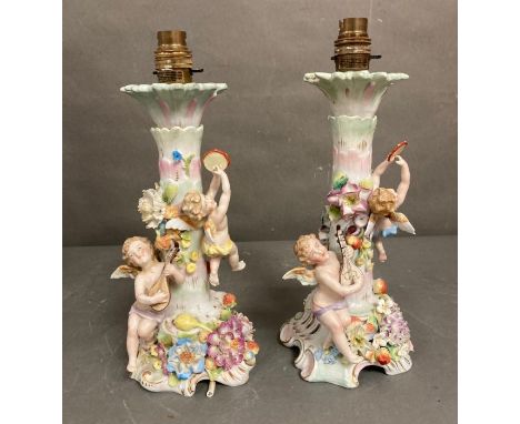 A pair of 19th Century porcelain candlesticks by Sitzendorf converted to lamp bases 