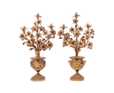 A pair of French gilt bronze urn form Candelabra, each with five sconces in the form of floral sprays issuing from the urns, 