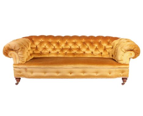 Hamptons of London; a large well-drawn three-seat Chesterfield style settee, late 19th century, with bold roll-over back and 