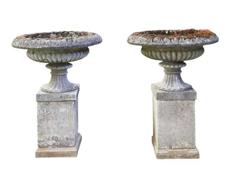 A large pair of well-established cast stone "Country House" garden tazza, probably first quarter of the 20th century, each of