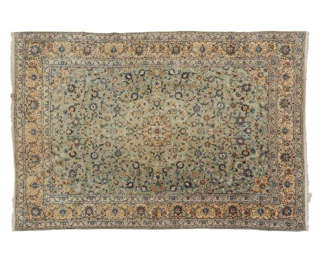 A pale blue ground room-size Kashan carpet, 20th century, with a "Book-Cover" design on a field filled with scrolling Islimi 