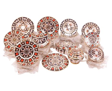 A large Royal Crown Derby part dinner service, in 1128 Imari comprising a teapot, tureen and cover, cakestand (28 cm diameter