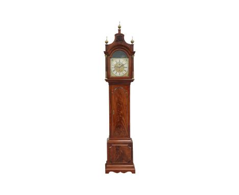 A George III mahogany longcase clock, the caddy top hood with fretwork and ball finials over brass stop fluted columns enclos