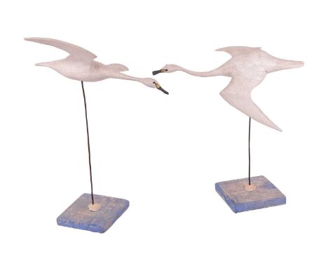 Guy Taplin (b.1939), a pair of swans in flighted, painted and carved wood, signed and numbered 4 & 5, each on a metalware sup