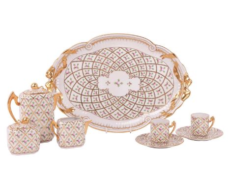 A Herend porcelain 'Sprog' coffee service on tray, enamelled with a rose and trellis deisgn within gilt borders, comprising a