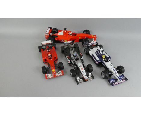 A Collection of Three Unboxed Hotwheels 2001 F1 Cars to Include No 1 Micheal Schumacher, N0 3 Mika Hakkinen and No 5 Ralf Sch