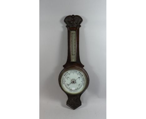 A Late Victorian Carved Oak Wheel Barometer with Temperature Scale, 79cm High