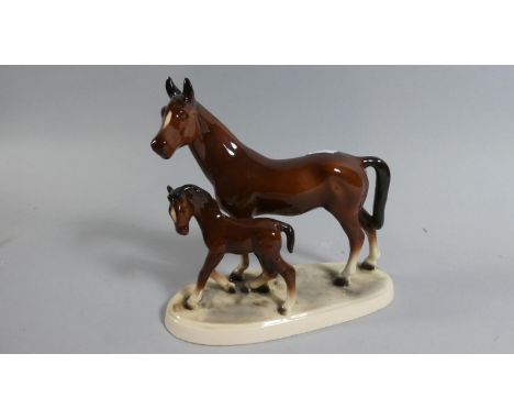 A Continental Ceramic Mare and Foal Ornament 