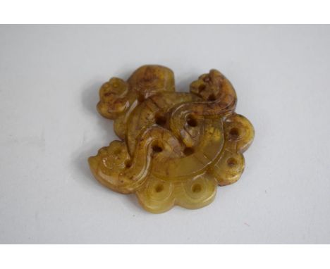 A Carved and Pierced Jade Pendant 