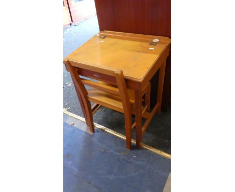 A Mid 20th Century Tri-Ang Stained Wood Childs Desk and Matching Chair. Desk has Hinged Sloping Top with Two Ceramic Ink Pots