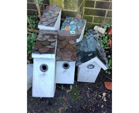 Five painted wood garden bird boxes with copper scale roofs, largest height 38cm. Condition - fair