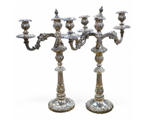 A pair of Victorian silver plated two branch three light candelabra, 54cm high. Condition - fair-good