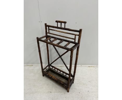 A late Victorian bamboo stick stand, width 56cm, height 98cm. Condition - poor to fair